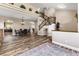 A spacious living room with a staircase and an open layout into the dining area at 5452 Desert Spring Rd, Las Vegas, NV 89149