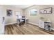 Bright office space featuring a modern desk, whiteboard, and cheerful decor at 5452 Desert Spring Rd, Las Vegas, NV 89149