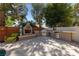 Outdoor kitchen features a fireplace, built-in grill, counter space, and seating area at 5452 Desert Spring Rd, Las Vegas, NV 89149