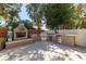 Outdoor kitchen with stainless steel grill, refrigerator, sink, and ample counter space for outdoor cooking and entertaining at 5452 Desert Spring Rd, Las Vegas, NV 89149
