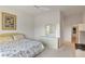 Comfortable bedroom featuring a floral-patterned bedspread, ceiling fan, and neutral decor at 585 Mountain Links Dr, Henderson, NV 89012