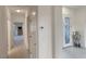 Bright hallway showcasing elegant tile flooring and access to various rooms in the home at 585 Mountain Links Dr, Henderson, NV 89012