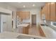 Functional kitchen with tiled floor, an island, stainless steel appliances, and plenty of cabinet storage at 585 Mountain Links Dr, Henderson, NV 89012