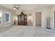 Airy living room featuring neutral walls, plush carpeting, and large windows with sheer curtains at 585 Mountain Links Dr, Henderson, NV 89012