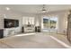 Spacious living room with large windows offering views of the lush golf course at 585 Mountain Links Dr, Henderson, NV 89012