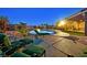 Relaxing backyard featuring a pool, spa, built-in BBQ, and ample seating for outdoor entertaining at 6208 W Rome Blvd, Las Vegas, NV 89131