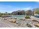 Backyard view of the pool and rock landscape at 6208 W Rome Blvd, Las Vegas, NV 89131