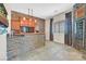 Home wet bar featuring stone accents, barstool seating, and wine storage at 6208 W Rome Blvd, Las Vegas, NV 89131