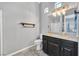 Modern bathroom featuring a stylish vanity, toilet, and shower with glass enclosure at 6208 W Rome Blvd, Las Vegas, NV 89131