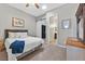 Bedroom features carpet, a comfortable queen bed, a large mirror, and a closet at 6208 W Rome Blvd, Las Vegas, NV 89131