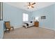Bedroom with carpet, a twin bed, small table, and a large window for plenty of natural light at 6208 W Rome Blvd, Las Vegas, NV 89131