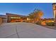 Large driveway lined with manicured shrubs leads up to a well-kept single Gathering home at 6208 W Rome Blvd, Las Vegas, NV 89131