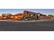 Desert home featuring manicured landscaping, a two-car garage, and brick details at 6208 W Rome Blvd, Las Vegas, NV 89131