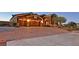 Charming single-story home featuring a brick driveway and a well-manicured front yard at 6208 W Rome Blvd, Las Vegas, NV 89131
