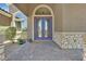 Inviting front entrance with brick flooring and double doors with glass inserts at 6208 W Rome Blvd, Las Vegas, NV 89131
