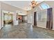 Expansive living area with tile flooring and views into the bar and front door at 6208 W Rome Blvd, Las Vegas, NV 89131