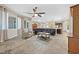 Expansive open concept living room with tile floors, modern furnishings, and abundant natural light at 6208 W Rome Blvd, Las Vegas, NV 89131