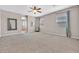 Large main bedroom features a ceiling fan, ensuite bath, and ample natural light from windows at 6208 W Rome Blvd, Las Vegas, NV 89131