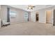 Bright main bedroom with carpet, ceiling fan, and windows, offering a cozy retreat at 6208 W Rome Blvd, Las Vegas, NV 89131