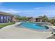 Beautiful pool with a spa and backyard seating is perfect for entertaining at 6208 W Rome Blvd, Las Vegas, NV 89131