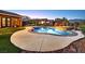 Gorgeous backyard oasis includes a sparkling pool, built-in spa, mature landscaping, and pavers at 6208 W Rome Blvd, Las Vegas, NV 89131