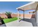 Inviting backyard with a covered patio, lawn, and block fence at 6346 Azurelyn Ave, Las Vegas, NV 89122