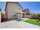 Spacious backyard featuring covered patio, lawn, and block fencing at 6346 Azurelyn Ave, Las Vegas, NV 89122