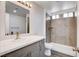 Well-lit bathroom featuring vanity with sink and tiled walk-in shower with dual shower heads at 6346 Azurelyn Ave, Las Vegas, NV 89122