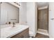 Modern bathroom with a walk-in shower, white cabinets, and wood-look floors at 6346 Azurelyn Ave, Las Vegas, NV 89122