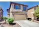 Two story home with a two car garage and desert landscaping at 6346 Azurelyn Ave, Las Vegas, NV 89122