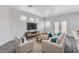 Cozy living room with hardwood floors, modern furniture and plenty of light at 6346 Azurelyn Ave, Las Vegas, NV 89122