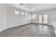 Bright living room featuring hardwood floors and sliding glass doors to the backyard at 6346 Azurelyn Ave, Las Vegas, NV 89122