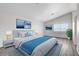 Beautiful primary bedroom with view, blue accents and hard wood floors at 6346 Azurelyn Ave, Las Vegas, NV 89122