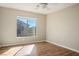 Bedroom with wood-look floors and natural light from the window at 6610 Tumbleweed Ridge Ln # 101, Henderson, NV 89011