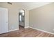 Empty bedroom with wood-look floors and en-suite bathroom at 6610 Tumbleweed Ridge Ln # 101, Henderson, NV 89011