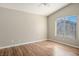 Bright bedroom with wood-look flooring and large window at 6610 Tumbleweed Ridge Ln # 101, Henderson, NV 89011