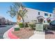 Well-maintained townhome with stucco exterior and landscaped front yard at 6610 Tumbleweed Ridge Ln # 101, Henderson, NV 89011