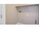 Functional laundry area with shelving and utility connections at 6610 Tumbleweed Ridge Ln # 101, Henderson, NV 89011