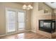 Close-up of a living room with a fireplace and view of backyard at 6610 Tumbleweed Ridge Ln # 101, Henderson, NV 89011