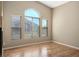 A living room with an open window and wood flooring at 6610 Tumbleweed Ridge Ln # 101, Henderson, NV 89011