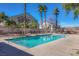 Community pool is clean and refreshing, surrounded by beautiful palm trees and landscaping at 6610 Tumbleweed Ridge Ln # 101, Henderson, NV 89011