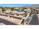 Community aerial view showcasing building architecture, landscaping, and convenient parking at 6635 Caporetto Ln # 204, North Las Vegas, NV 89084