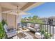Relaxing balcony with patio furniture, offering an inviting space for outdoor entertainment and lounging at 6635 Caporetto Ln # 204, North Las Vegas, NV 89084