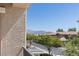 Balcony view showcasing the neighborhood's mature trees and distant mountains for a relaxing outdoor experience at 6635 Caporetto Ln # 204, North Las Vegas, NV 89084