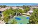 An open-air basketball court is surrounded by green landscaping, providing a great outdoor recreational area for residents at 6635 Caporetto Ln # 204, North Las Vegas, NV 89084