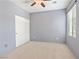 Simple bedroom with neutral carpet, sliding door closet and a ceiling fan at 6635 Caporetto Ln # 204, North Las Vegas, NV 89084