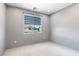 Unfurnished bedroom with neutral walls, a window with shades, and ceiling light at 6635 Caporetto Ln # 204, North Las Vegas, NV 89084