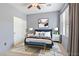 Staged bedroom features stylish decor, rug, and a bed with blue accents at 6635 Caporetto Ln # 204, North Las Vegas, NV 89084