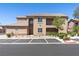 Inviting exterior view of a two-story home with manicured landscaping and convenient parking at 6635 Caporetto Ln # 204, North Las Vegas, NV 89084