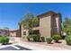 Landscaped view of a two-story home with a well-maintained lawn and inviting walkway at 6635 Caporetto Ln # 204, North Las Vegas, NV 89084